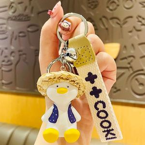 Wholesale Resin 3D Cartoon Happy Duck Keychain Cute Woven Straw Hat Duck Exquisite Accessories Bag Pendant Gift <b>Key</b> <b>Chain</b> - Product Image 6