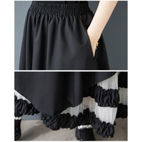 Nouvelle Robe d'été 2026 en gros pour femme, coupe trapèze asymétrique, patchwork en maille, taille haute, ample, noire, style chic français, coupe irrégulière