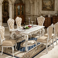 Ensemble de table à manger en marbre européen, chaises en bois massif sculptées à la main, revêtement en cuir capitonné, meubles de salle à manger de luxe pour villa