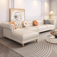 Canapé en cuir véritable de style français, trois places, en forme de L, couleur crème, pieds en bois massif, détails zippés, luxe léger, salon