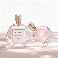 Flacon de parfum vide personnalisé de haute qualité 30ml 50ml 100ml Boîte ronde en verre transparent avec pulvérisateur à pompe de luxe Impression d'écran