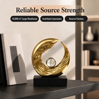 Sculpture d'onde en résine dorée avec sphère et base noire, figurine géométrique abstraite pour décoration d'étagère de salon
