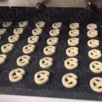 Machine à former des biscuits et des gâteaux entièrement automatique multifonctionnelle en acier inoxydable AIDA pour usage en boulangerie avec farine et maïs