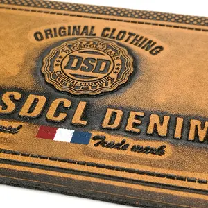 Fabricante personalizado PU couro remendo logotipo em relevo fino jeans couro etiqueta para vestuário