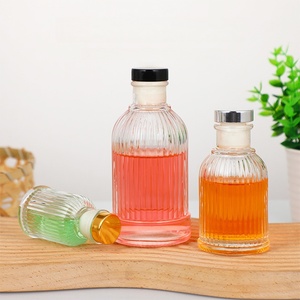 Hot Selling New Design 50ml 100ml 200ml Empty Vertical Stripe Cylinder Glass Reed <strong>Diffuser</strong> Bottle with Golden Stopper - Product Image 2