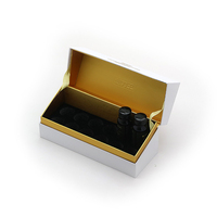Boîte cadeau rigide en or blanc de luxe sur mesure avec fermeture magnétique et insert pour flacons de compléments alimentaires liquides
