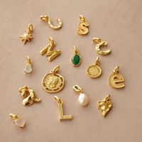 Nouveau design 2025 – Collier pendentif personnalisable en acier inoxydable plaqué or 18 carats avec breloques cœur, perle, fer à cheval et lettre – Cadeau idéal
