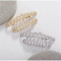 Fournisseur en gros de grilles dentaires plaquées or populaires avec diamants, bijoux de corps décoratifs de mode Hip Hop