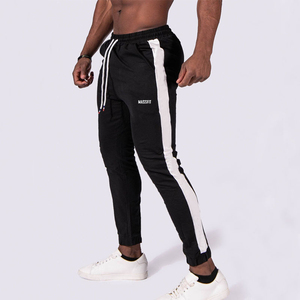 All'ingrosso tuta da uomo autunno pantaloni neri pantaloni da Jogger <span class=keywords><strong>con</strong></span> righe <span class=keywords><strong>bianche</strong></span> pantaloni da corsa sottili <span class=keywords><strong>con</strong></span> coulisse Hip Hop - Product Image 1