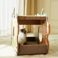 Arbre à chat double couche en carton ondulé, écologique, durable et facile à assembler, avec design dessin animé Chariot Citrouille, servant également de griffoir et de nid décoratif.