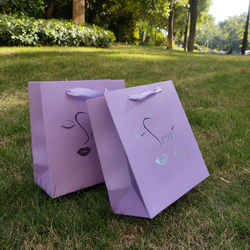 source 纸质礼品袋定制手提袋纸质购物袋银色标志礼品包装袋紫色胶印