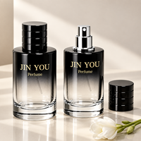 Vente en gros d'usine, flacon de parfum en verre vintage à logo personnalisé, dégradé de couleurs, cylindrique, fond épais noir, vaporisateur à pompe, écologique