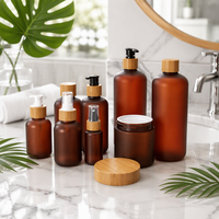 Pot et bouteille cosmétiques en plastique ambré en gros avec couvercle en bambou, conteneur d'emballage vide pour huile capillaire, shampoing, soins corporels