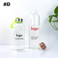 Bouteille en verre borosilicaté à haute teneur en borosilicate de cylindre transparent de 300ml 500ml 1000ml pour boire des bouteilles d'eau en verre réutilisables avec couvercles
