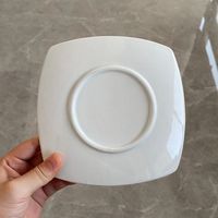 Vente en gros d'usine Assiette plate blanche en porcelaine de 6 pouces en stock pour restaurant, hôtel, mariage, restauration