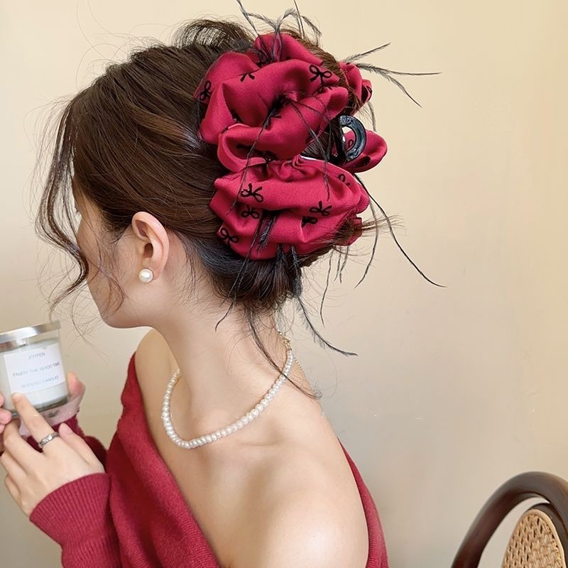 Papillon stampato con nuvole e piume - rosso