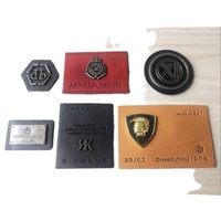 Etiquettes gravées en cuir avec logo en relief en métal personnalisées Etiquettes de vêtement en cuir PU pour étiquette de jeans de marque patchs en cuir