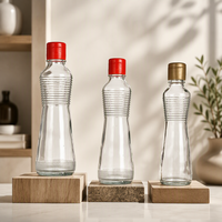 Bouteille en verre transparent pour huile et vinaigre avec bouchon métallique hermétique, idéale pour les assaisonnements et sauces de cuisine (vente en gros)