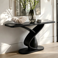 Table d'entrée noire de luxe moderne, console au design sculptural épuré et créatif pour villa, hôtel, couloir