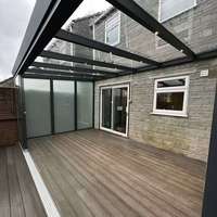 Prix de gros pour véranda en polycarbonate avec structure renforcée et design imperméable, idéale pour villa et cour.