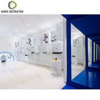 Design de salle d'exposition de chaussures moderne personnalisé Présentoir à chaussures mural avec lumière LED Meubles de présentoir à chaussures
