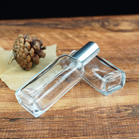 Flacon de parfum en verre rectangulaire transparent de 25 ml, vente en gros, avec embout serti, emballé en carton