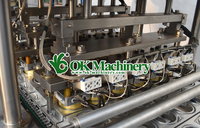 Machine de remplissage de tasse de dosage de liquide volumétrique automatique