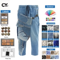 OEM ODM Pantalon en jean asymétrique patchwork pour homme, style tablier, avec mousqueton tactique et sangle, coupe courte, Sashiko Boro Harem