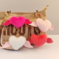 En gros, Porte-clés et pendentif de sac en fausse fourrure, motif dessin animé, pompon cœur, boule de fourrure, pompon en peluche, fleur pour voiture