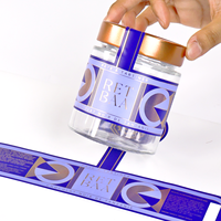 Étiquettes personnalisées avec logo, bouteille en verre bleue, rouleau adhésif, impression personnalisée imperméable pour l'emballage des produits, provenant du fabricant