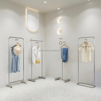 Étagères de présentation de vêtements en acier inoxydable pour magasin de vêtements pour femmes, vente directe d'usine Dy Design