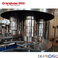 Machine automatique de remplissage et de bouchage de bouteilles de petite taille pour boissons gazeuses, eau et bière en fût