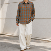 Chemise femme en lin lavé uni respirant à manches longues, boutonnée sur le devant, col rabattu, poche poitrine, ourlet effiloché, coupe ample, style vintage