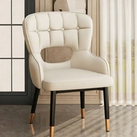 Fauteuil ergonomique moderne avec dossier creux et rembourré, chaise de salle à manger à dossier haut pour hôtel, villa, maison d'hôtes et restaurant