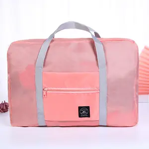 Bolso de lona rosa para hombre y mujer, bolsa de viaje plegable con diseño personalizado para ahorrar espacio, venta directa de fábrica