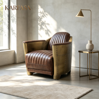 Fauteuil vintage aviateur avec accents de rivets métalliques, style industriel rétro, en cuir véritable, pour salon, bureau ou hôtel