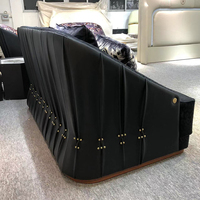 Vente en gros d'usine de meubles modernes et luxueux au design scandinave canapé en cuir véritable fauteuils de loisirs en cuir noir