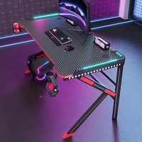 Bureau de jeu professionnel en métal en forme de K avec éclairage LED RGB, plateau en fibre de carbone, support pour casque et style moderne et épuré