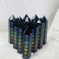 Vente en gros de tours de cristal en obsidienne noire gravées avec symboles des sept chakras, comme cadeaux de pierres de guérison