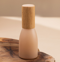 Bouteille de parfum Morandi de 12ml avec bouchon en noyer Bouteille d'huile essentielle à bille avec bouchon en hêtre givré Bouteille de décantation de parfum