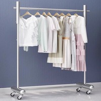 Présentoir mobile moderne en métal écologique sur pied pour magasin de vêtements féminins, idéal pour vitrine, diffusion en direct et chambre