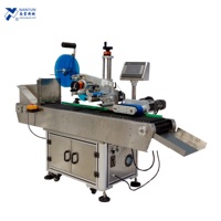 Machine d'étiquetage horizontale automatique NY-821 avec codeur de date pour objets cylindriques, sacs et pochettes - Étiquetage à 360 degrés