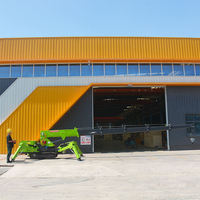Grue araignée de 4 tonnes avec flèche télescopique et hauteur de levage de 15 m pour l'installation de vitrages et la façade de bâtiments