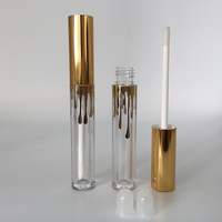 Boîte personnalisée logo 4ml tube de brillant à lèvres rond en plastique or noir, récipient transparent pour brillant à lèvres avec capuchon noir doré