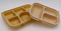 Biologisch afbreekbare wegwerpmaaltijdtrays, -borden en -kommen van maïszetmeel PLA PBAT, gemaakt met een energiezuinige thermoformmachine.