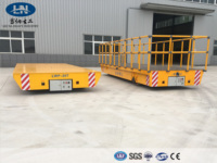 Chariot de transfert électrique sans rail de 30 tonnes avec conception à clôture, commande à distance et évitement automatique des obstacles. Demandez un devis.