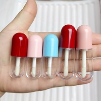 JIE MEI Pack populaire 3ML 4ML mignon pilule Capsule Style baguette de brillant à lèvres Tube conteneur Logo personnalisé Mini bouteille de brillant à lèvres pour testeur