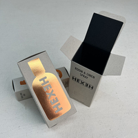 Boîte en carton personnalisée pour parfum, en papier recyclé, texture vintage grise, avec logo en feuille d'or bronze, gaufrage et débossage