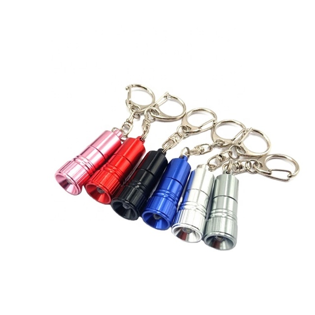 Mini Keychain Pocket Torch – USB Rechargeable LED Flashlight With Key Ring, Compact & Durable ABS/Latex Design