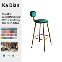 Tabouret de bar en velours avec structure en acier inoxydable brossé doré, coussin rond et dossier flottant pour îlot de cuisine